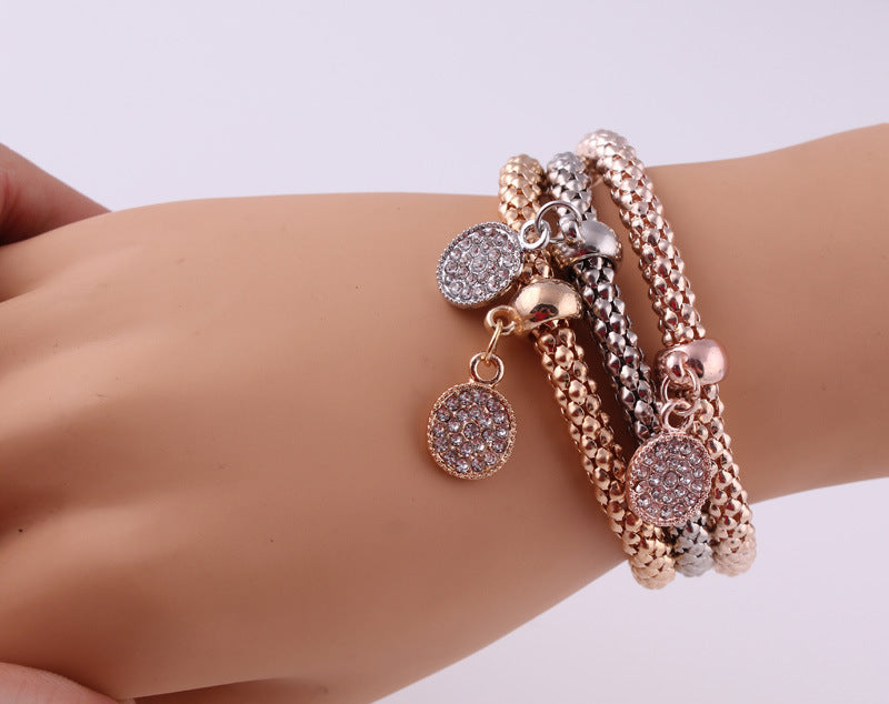 Jeweled Metal Disc Charm Bracelets