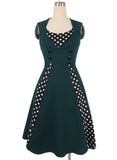 Polka dot contrast-knop-accent mouwloze jurk